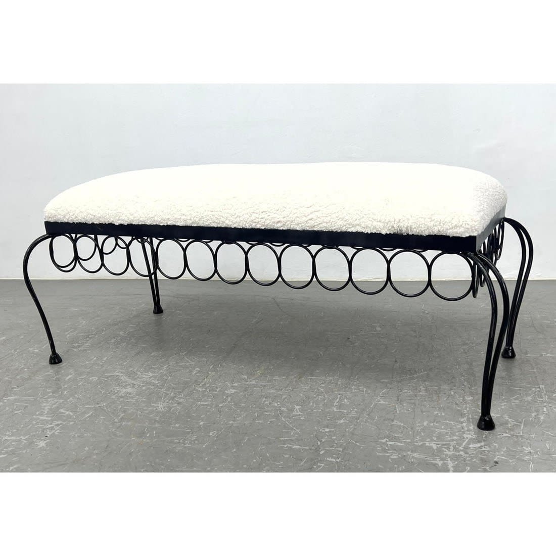 Contemporary iron bench with concentric