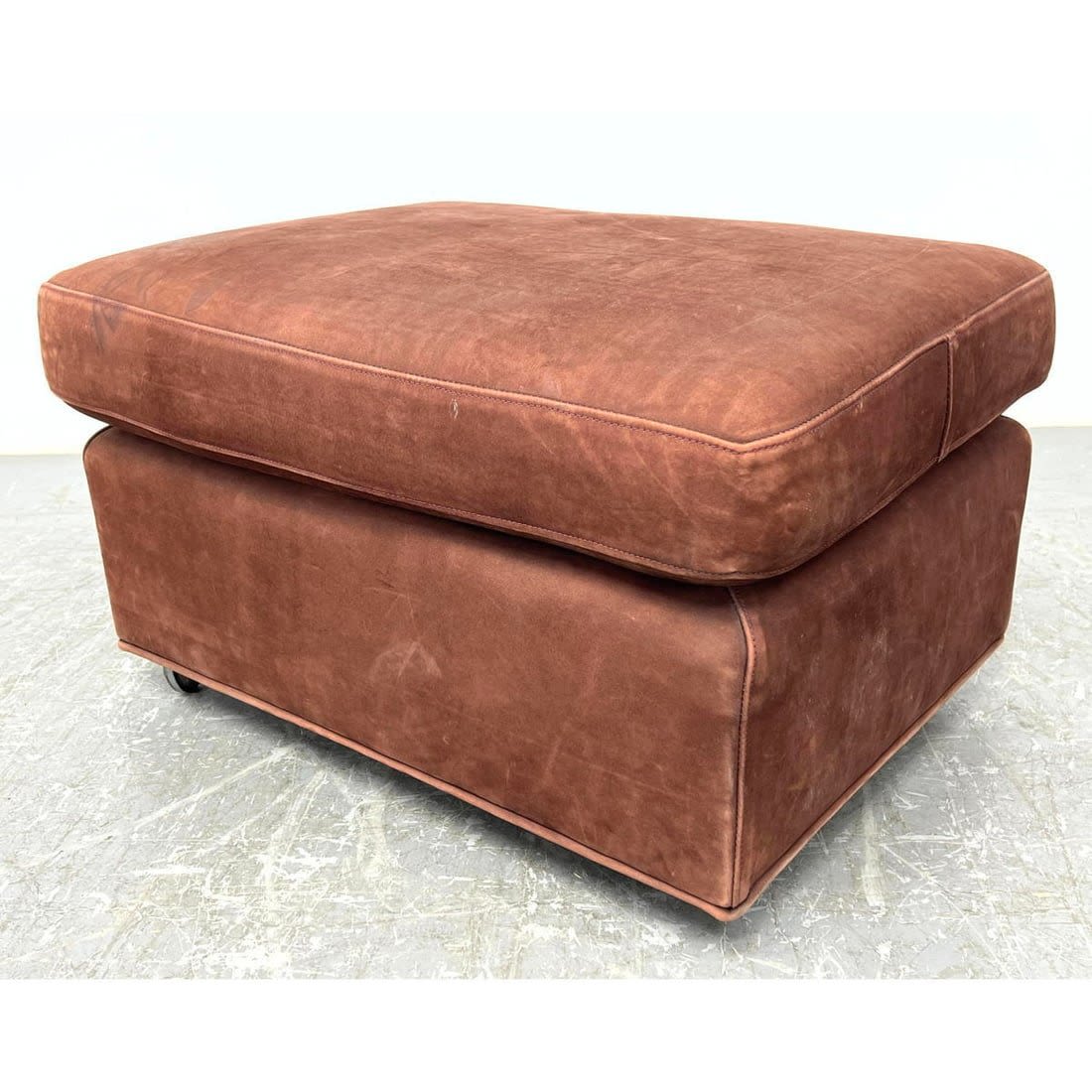 Suede Leather Ottoman Stool on Casters.