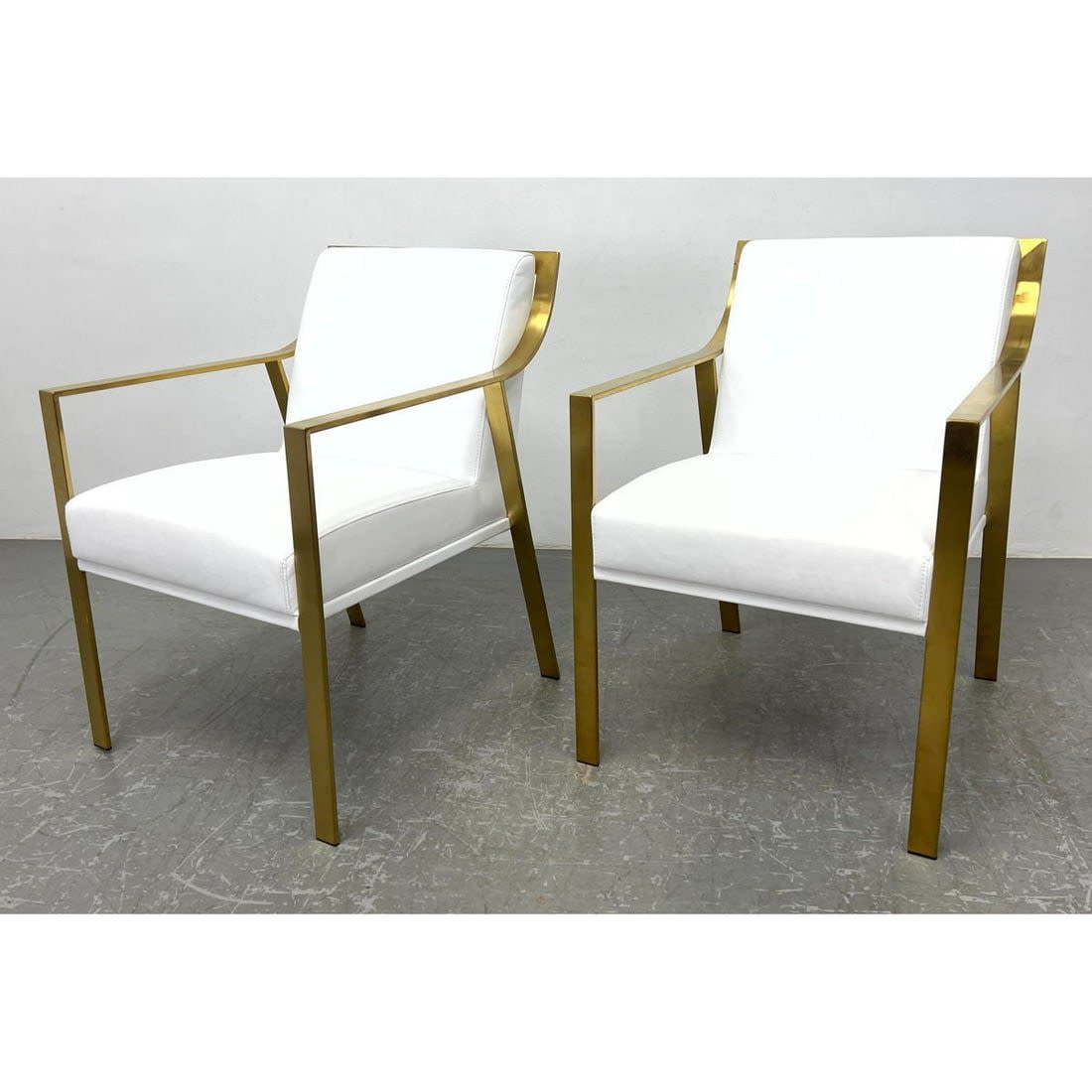 Pair Brass tone lounge chairs.