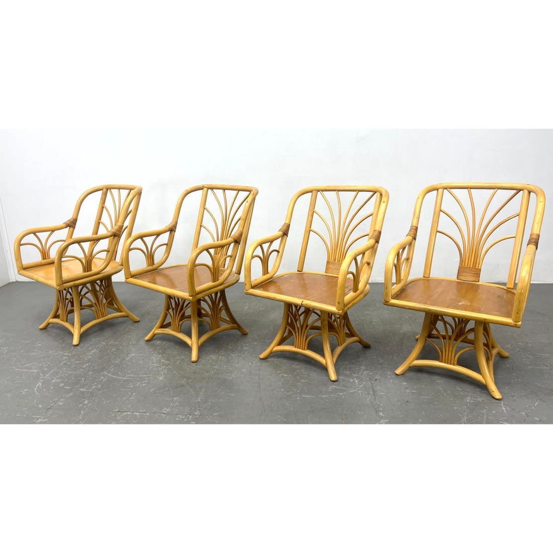 Set of 4 Bamboo Swivel Base Arm Chairs.