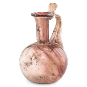 A Roman Glass Jug with Fluted Handle