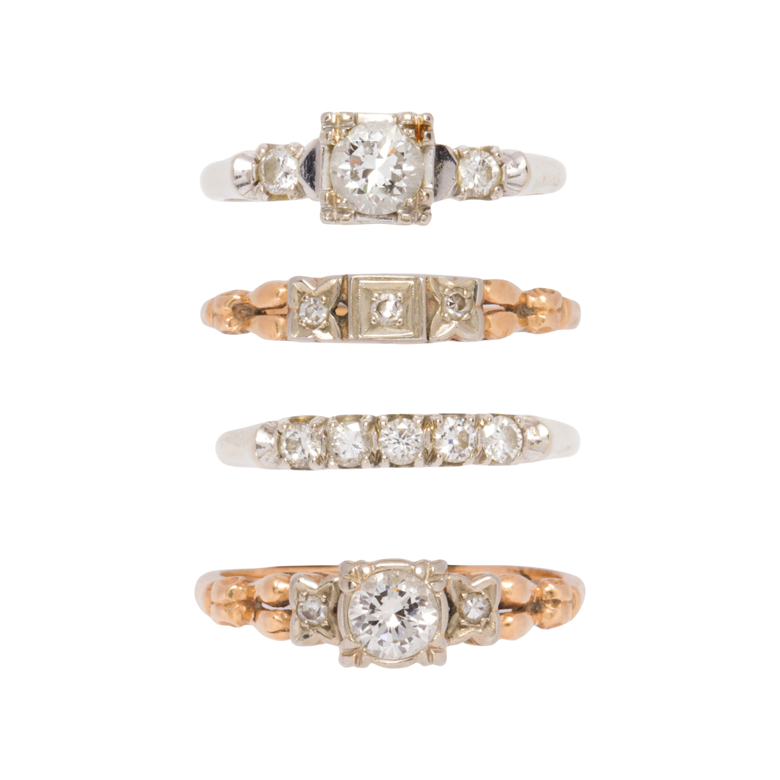 FOUR DIAMOND AND 14K GOLD RINGS Four