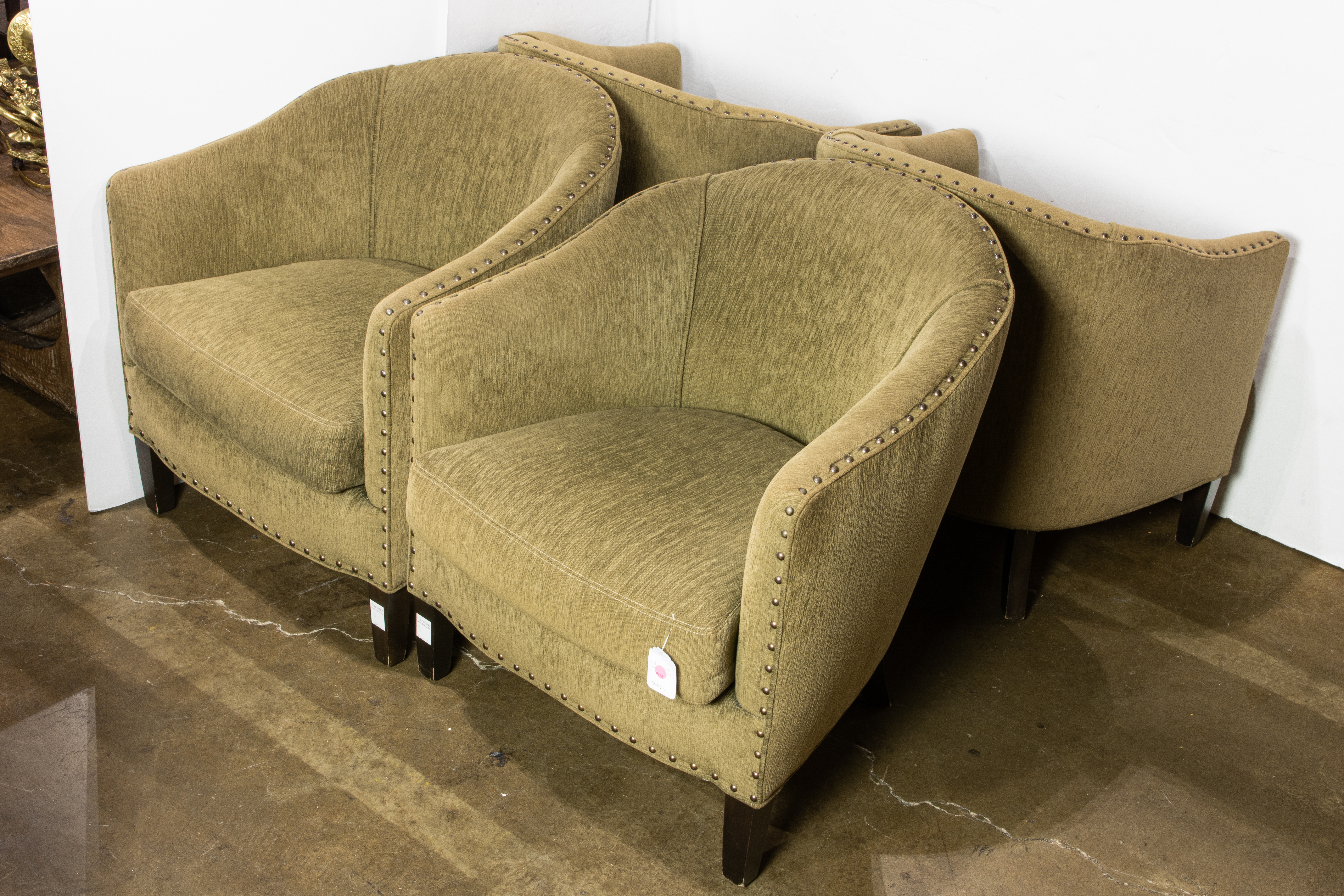 A SET OF FOUR GREEN UPHOLSTERED