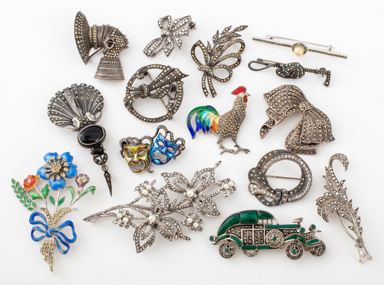 ART DECO SILVER AND MARCASITE BROOCHES,