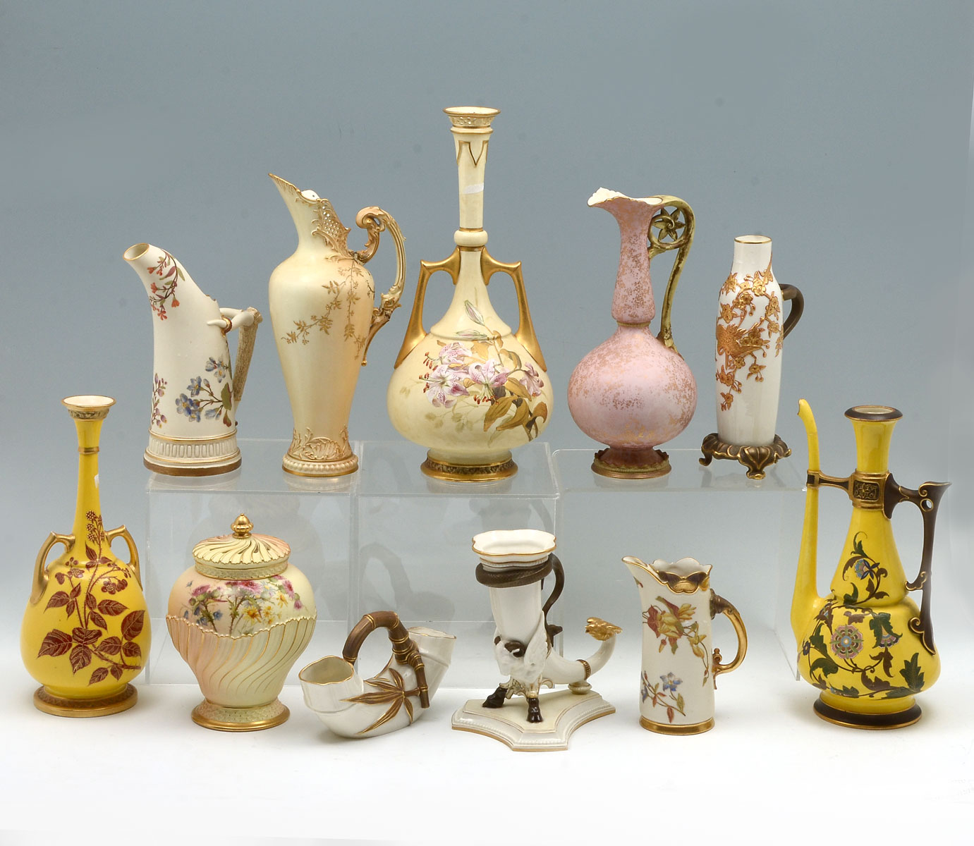 11 PC. ROYAL WORCESTER EWERS,