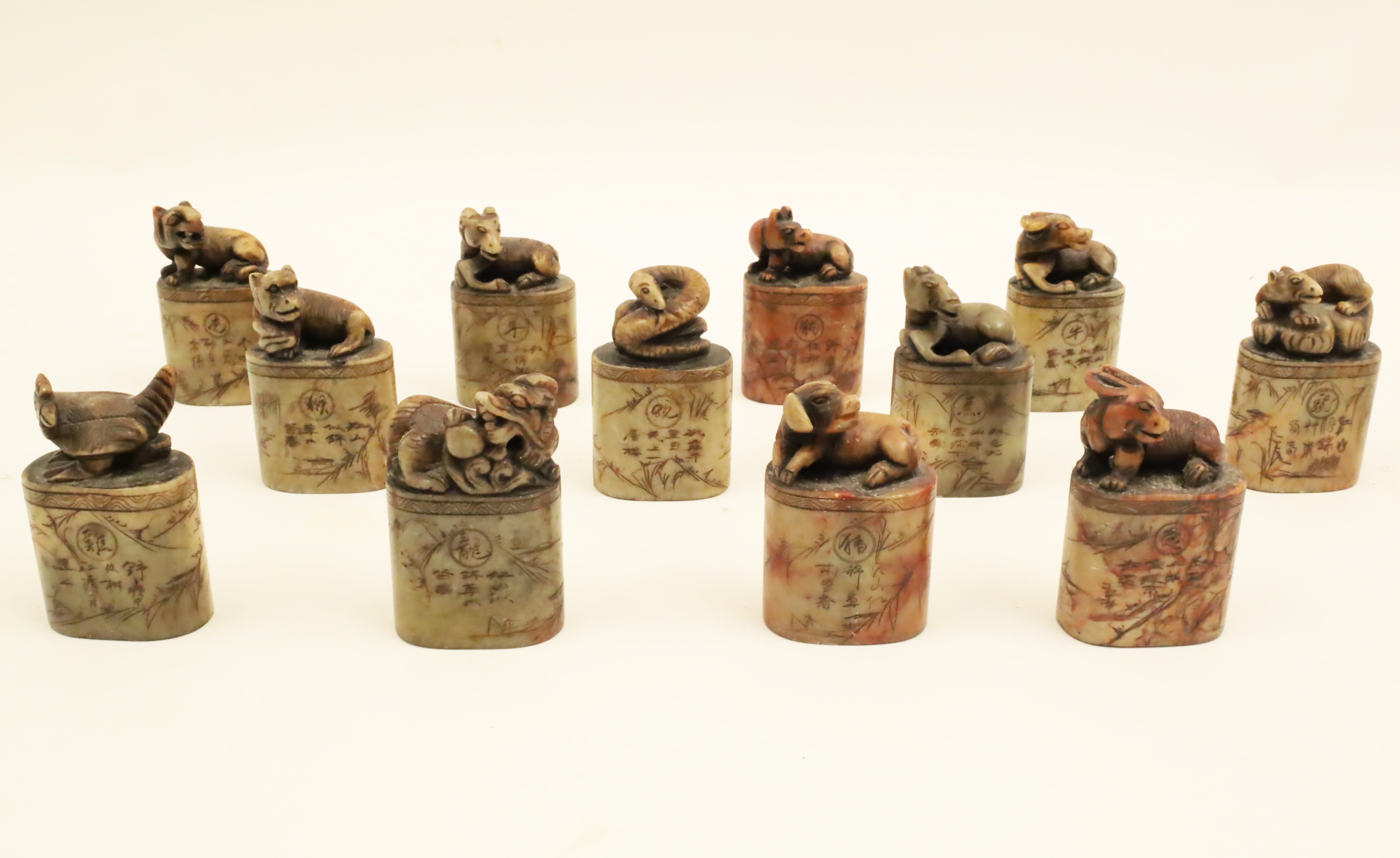 12 INDIVIDUALLY CARVED SOAPSTONE