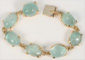 14 KARAT GOLD AND CABOCHON BER