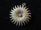 14 karat yellow gold starburst