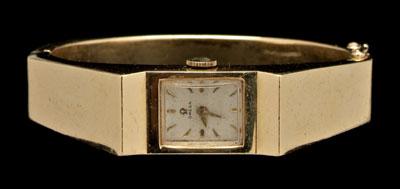 14 kt. yellow gold bangle watch,