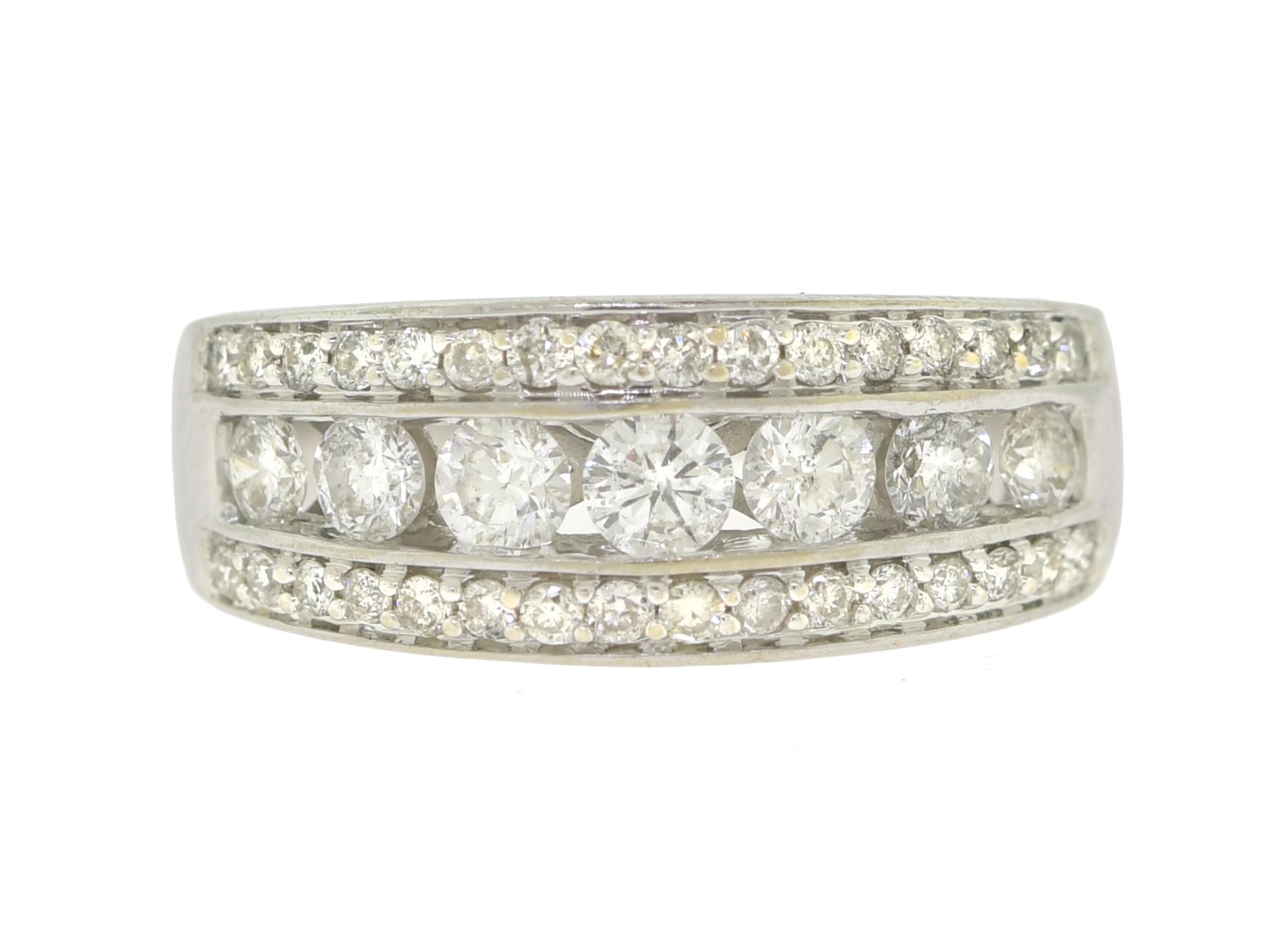 14K GOLD AND DIAMOND BAND. Seven