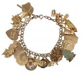 14KT. CHARM BRACELET WITH 29 C