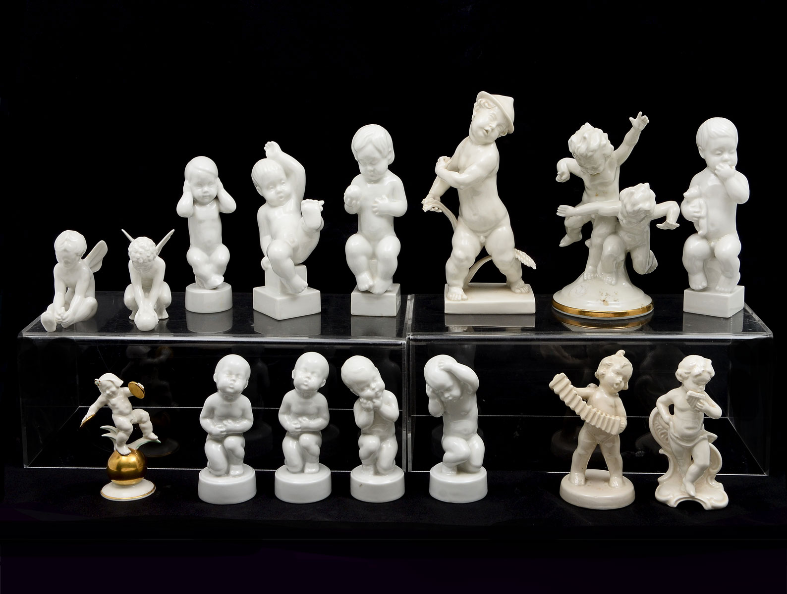 15 WHITE PORCELAIN PUTTI FIGURES: