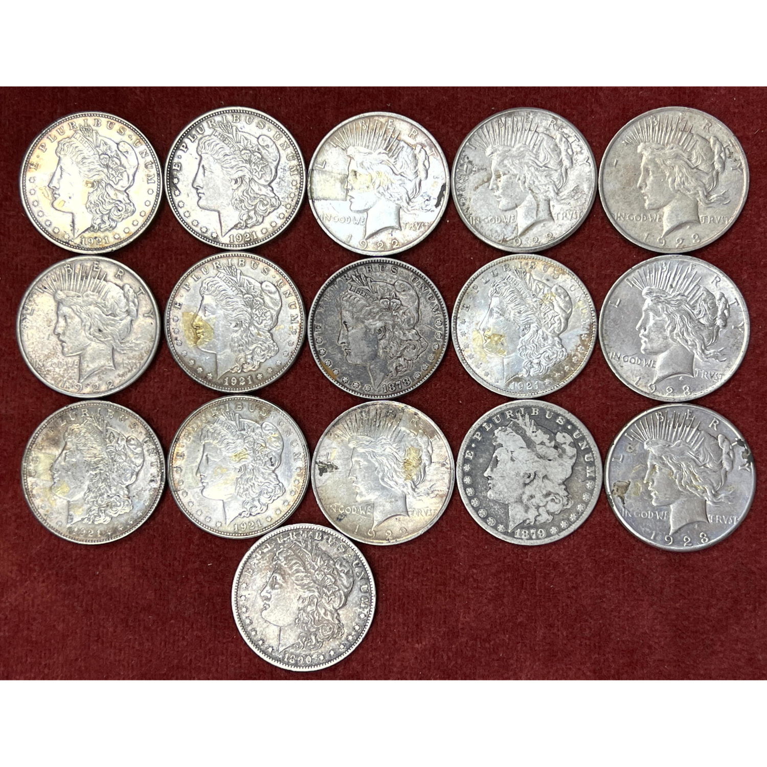 16 US Silver dollars. Most