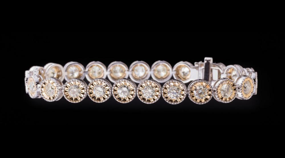 18 KT. WHITE AND YELLOW GOLD AND