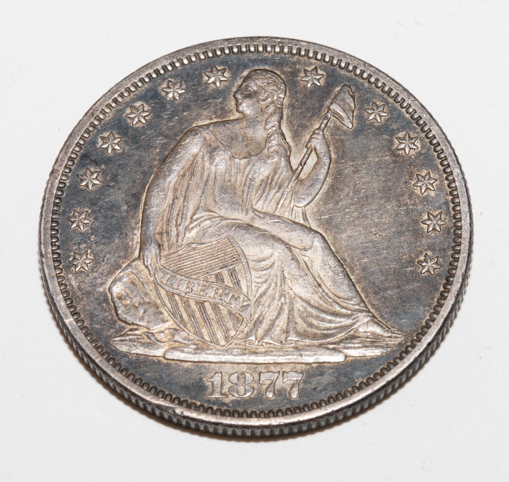 1877-S SEATED HALF AU55