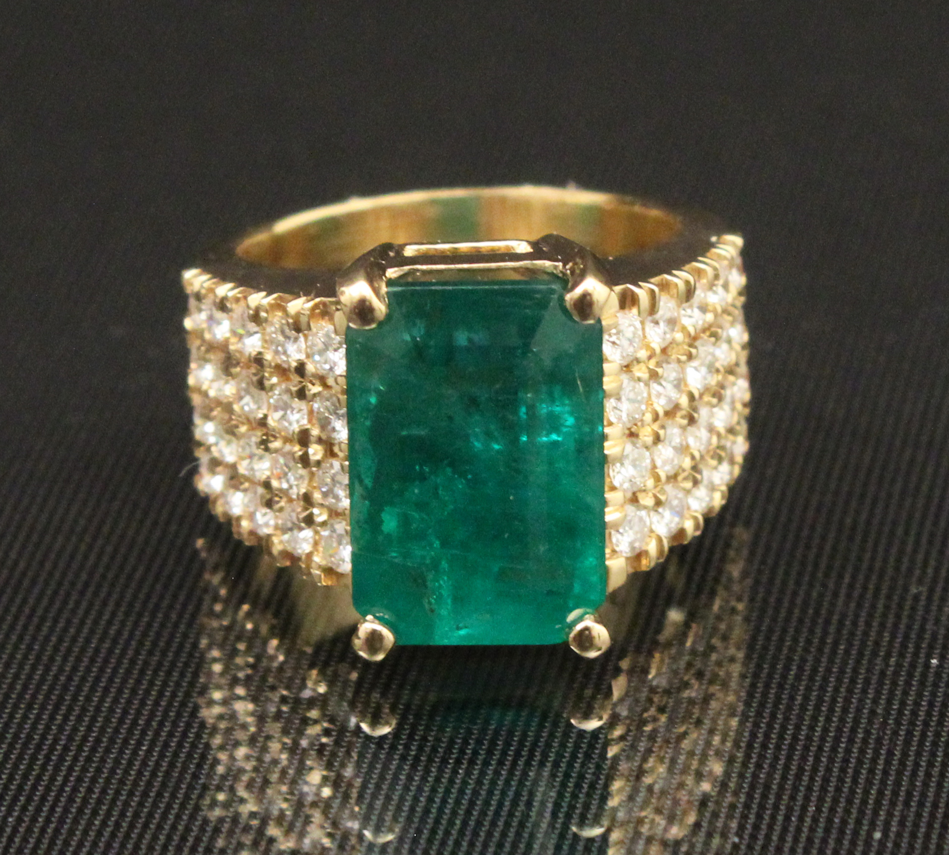 18K  DIAMOND AND 7.23 CT. EMERALD
