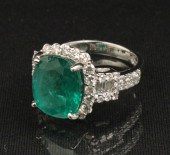 18K EMERALD AND DIAMOND RING;