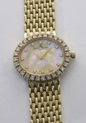 18K gold and diamond Baume and