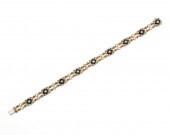 18K GOLD, DIAMOND, AND ONYX BR