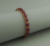 18K YELLOW GOLD AND RUBY BRACE
