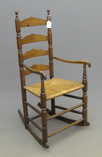 18th c. ladderback armed rocker.