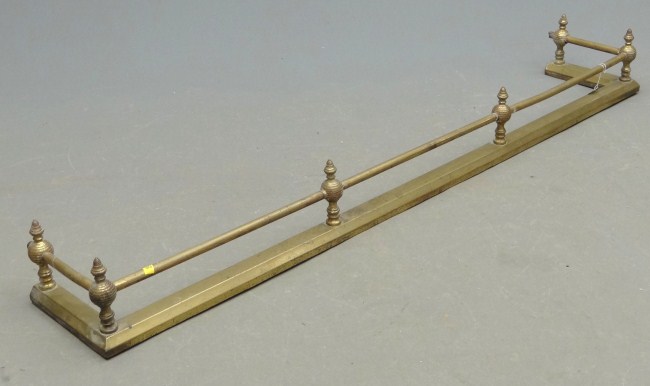 19th c. brass fireplace fender.