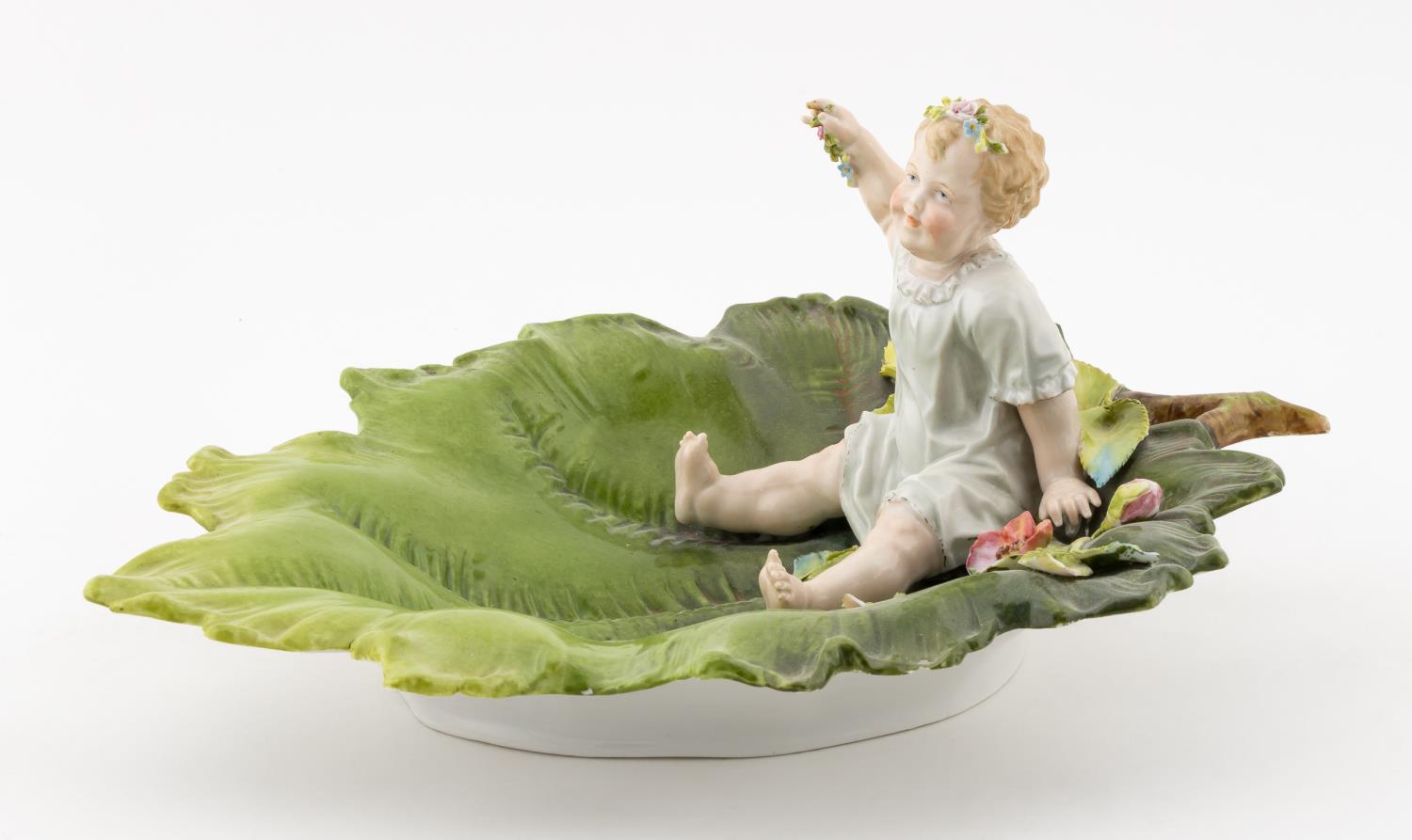 19TH C., MEISSEN BABY ON A LEAF