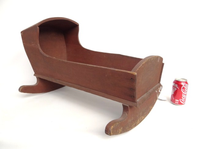 19th c. pine doll cradle in old red