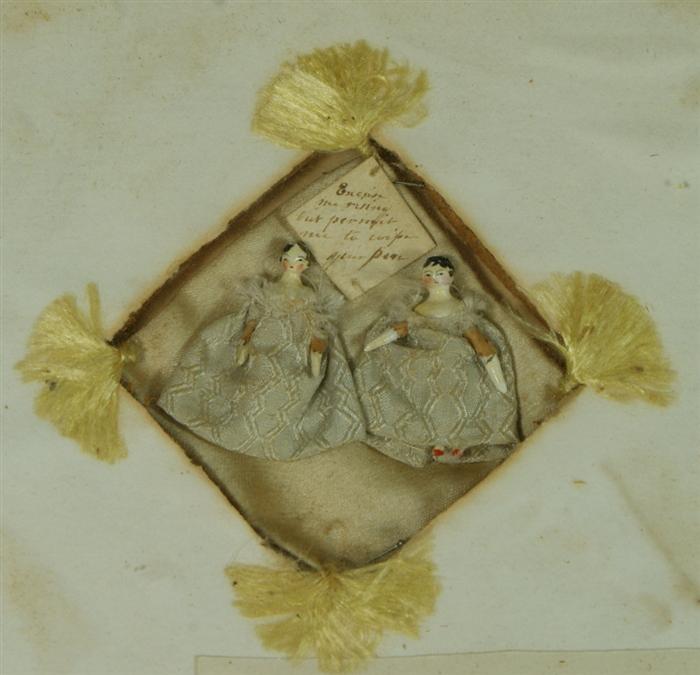 2 carved cork miniature dolls, with