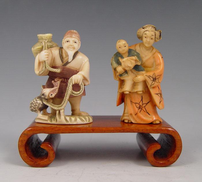 2 CARVED IVORY NETSUKES FISHERMAN &