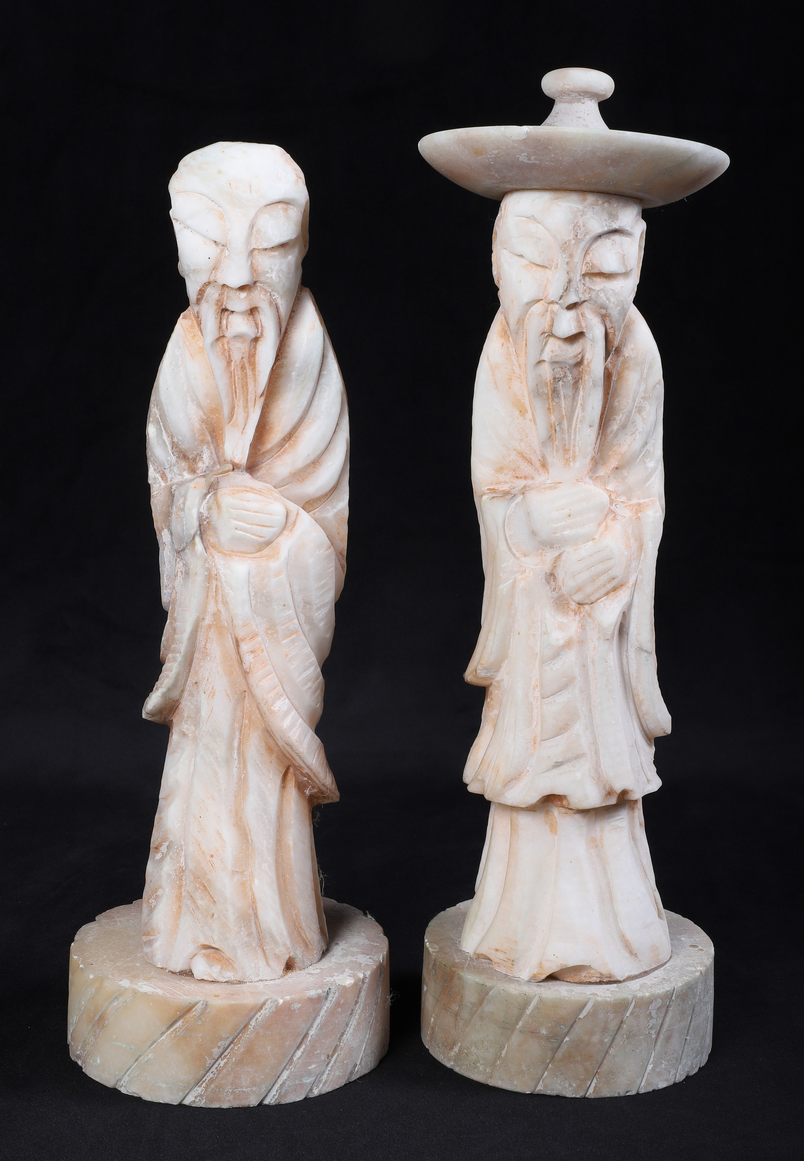 (2) Carved stone Asian figurines,