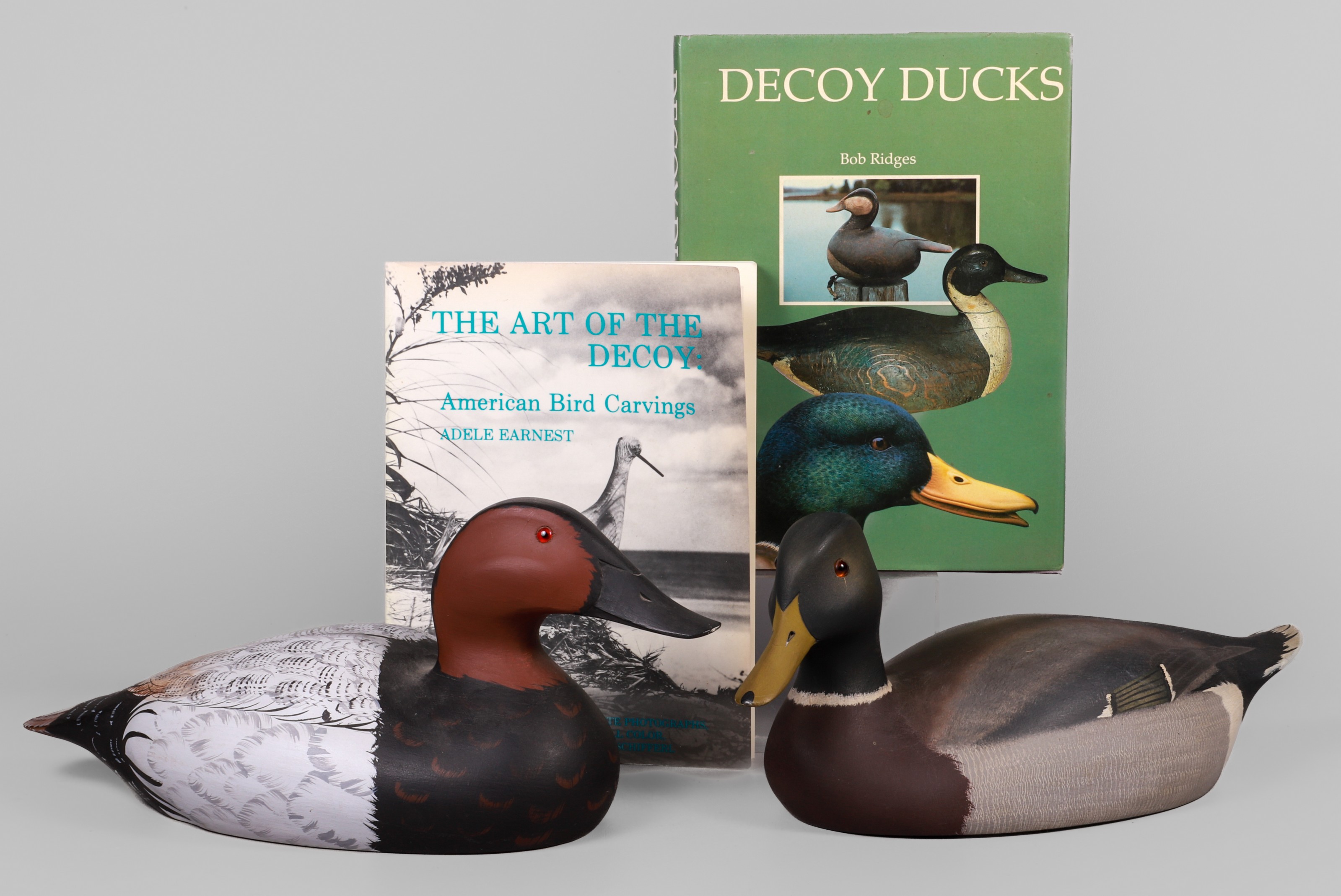 (2) Duck decoys & books, c/o