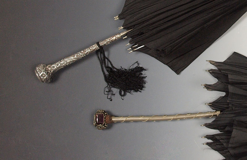2 LATE VICTORIA UMBRELLAS ONE