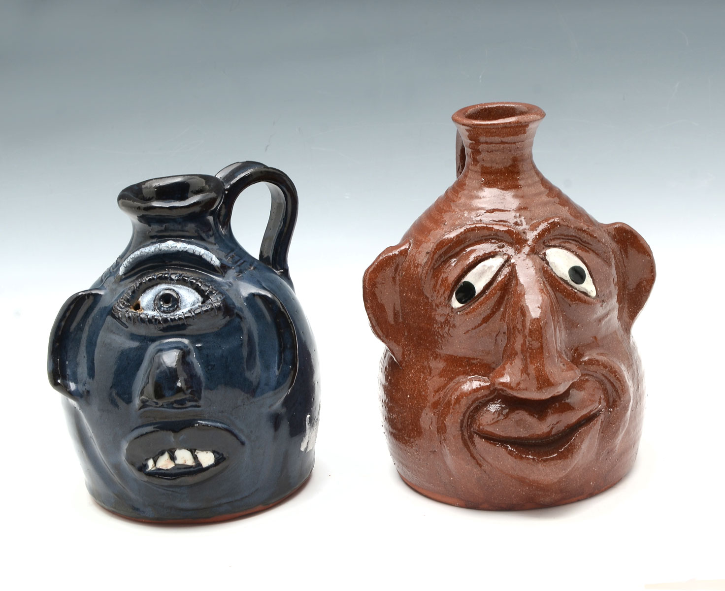 2 NORTH CAROLINA FACE JUGS: