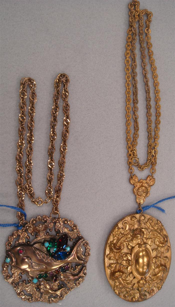 2 ornate pendants suspended on