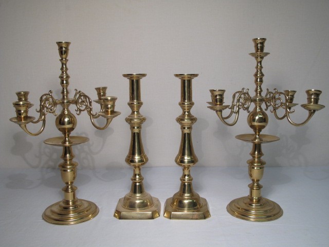 2 pairs of brass candle sticks.
