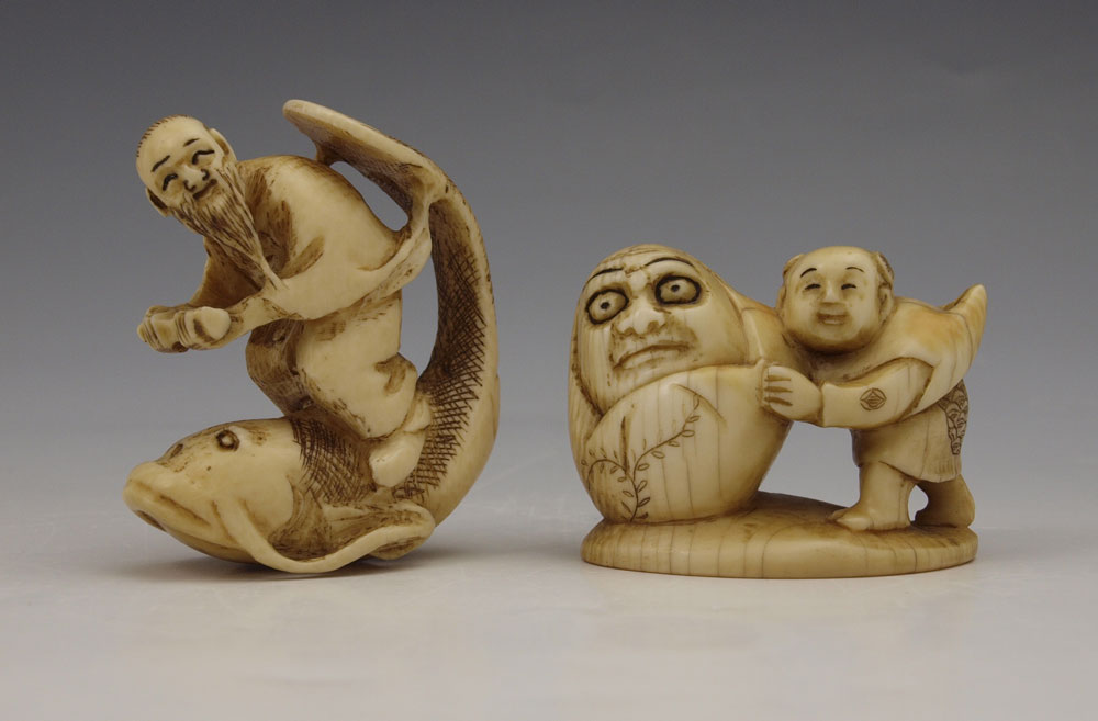 2 PIECE CARVED IVORY MAN ON FISH