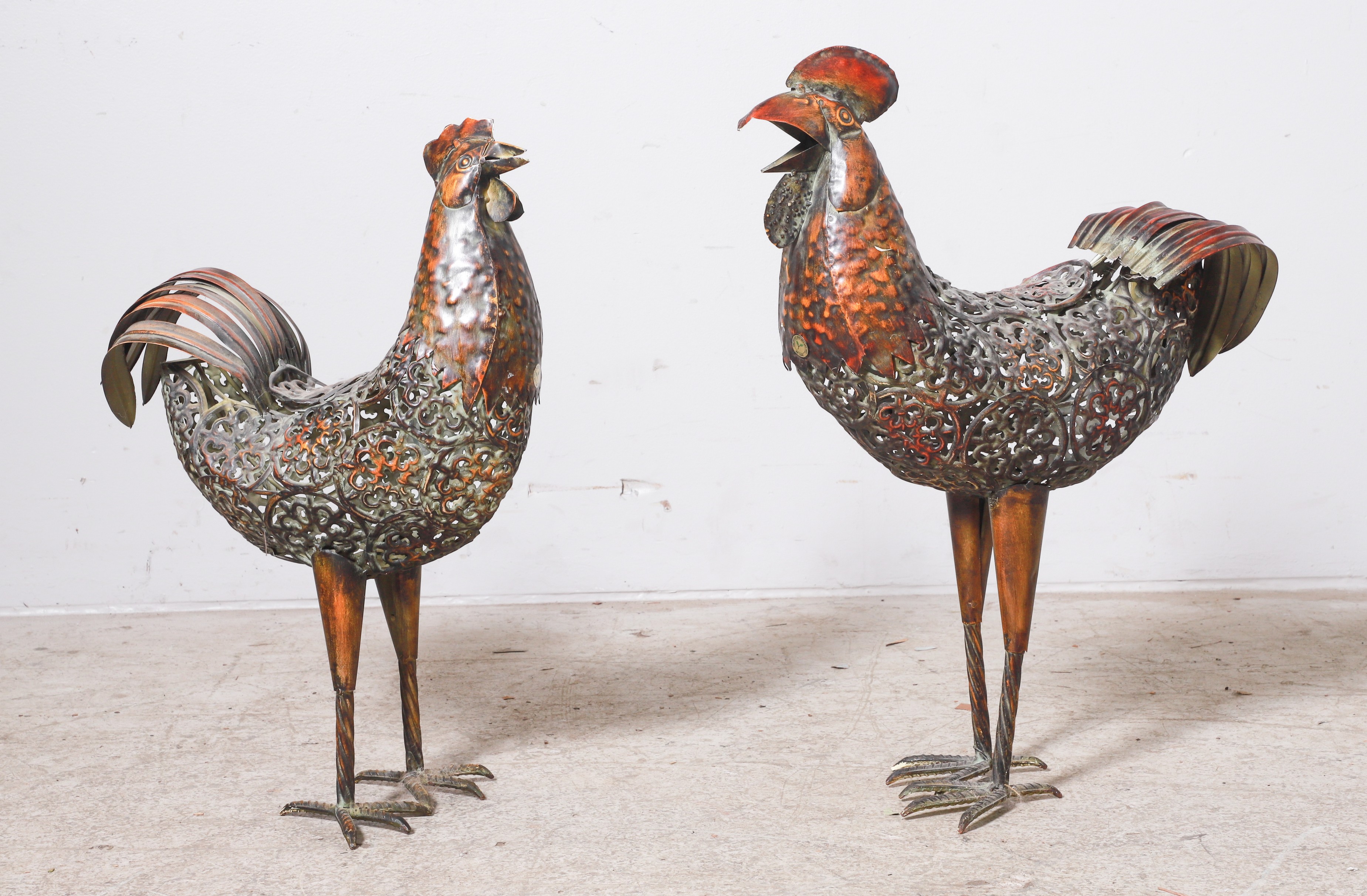 (2) Pierced metal garden statues of