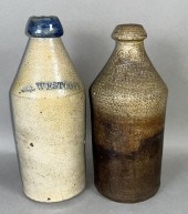2 STONEWARE BEVERAGE BOTTLES,