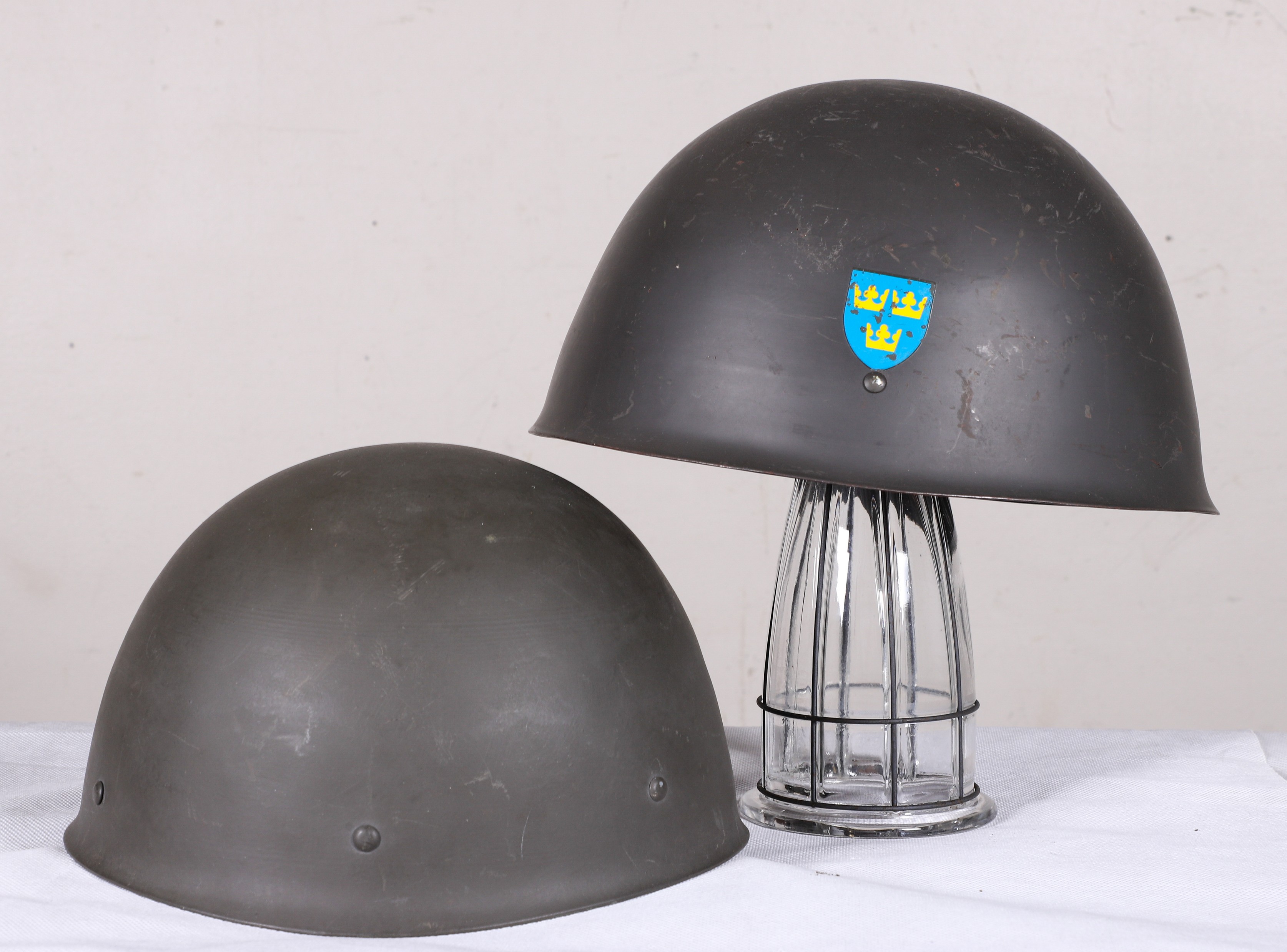 (2) Swedish military helmets,