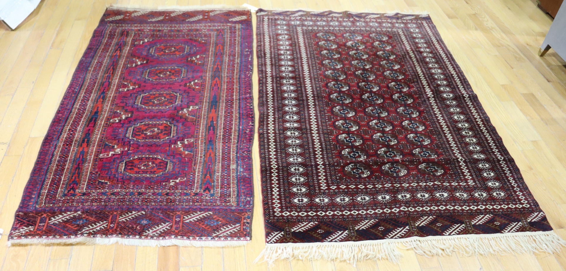 2 VINTAGE BOKHARA STYLE CARPETS.