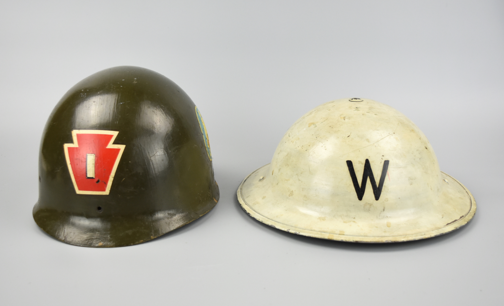 2 WWII MILITARY HELMETS An