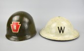 2 WWII MILITARY HELMETS An aut