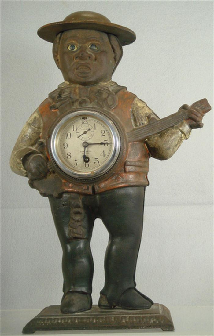 20th c cast iron banjo player