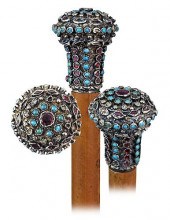 22. SILVER GILT AND JEWELED CA