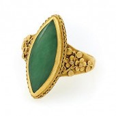 22K YELLOW GOLD AND JADE RING.