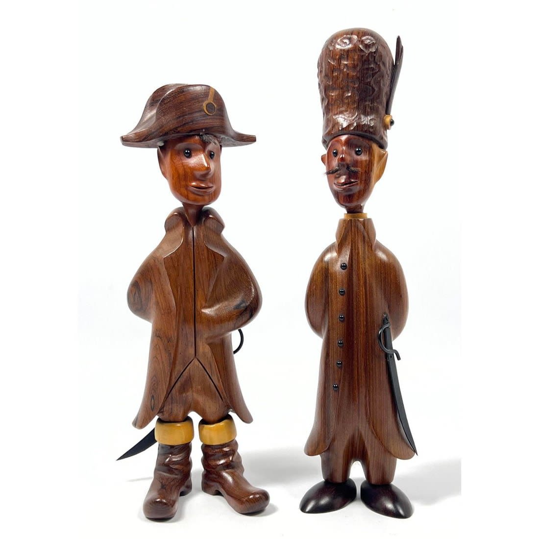2pc Ermanno carved wood figures.