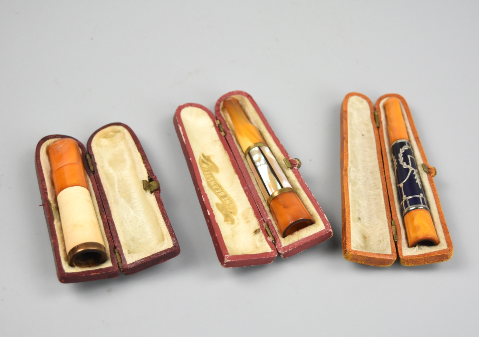 3 AMBER CIGGARETTE HOLDER, ONE W/