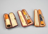 3 AMBER CIGGARETTE HOLDER, ONE