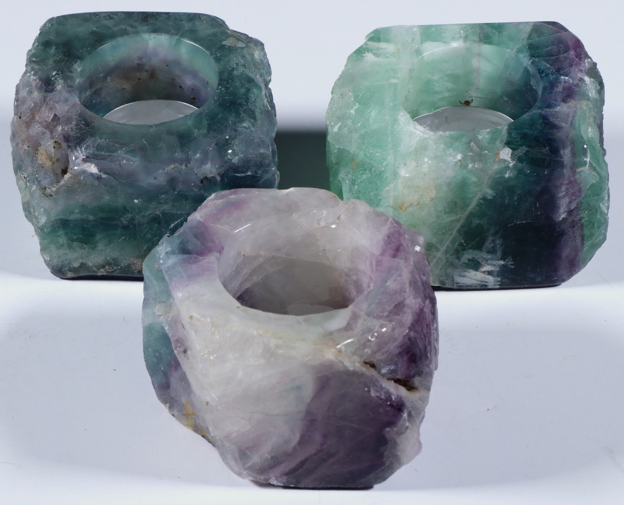 (3) CARVED STONE CANDLE HOLDERS (3)